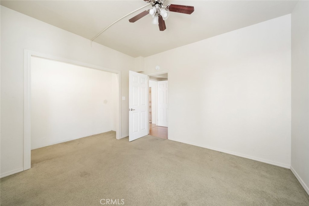 330 East Ormonde Road Arroyo Grande, CA 93420 - Photo 35 of 56 an empty room with a ceiling fan and carpet