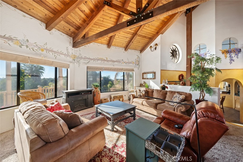 330 East Ormonde Road Arroyo Grande, CA 93420 - Photo 4 of 56 a living room with furniture a ceiling fan and a large window