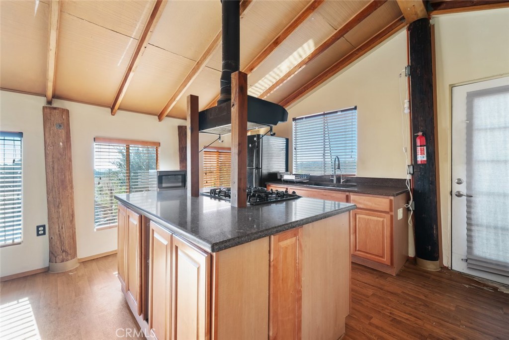 330 East Ormonde Road Arroyo Grande, CA 93420 - Photo 47 of 56 a kitchen with stainless steel appliances granite countertop a sink a stove and a wooden floors