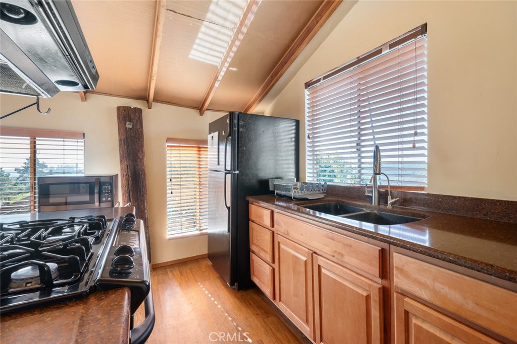 330 East Ormonde Road Arroyo Grande, CA 93420 - Photo 48 of 56 a kitchen with sink a window and furniture