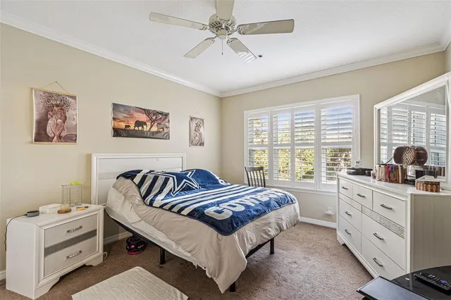 a spacious bedroom with a bed and a window