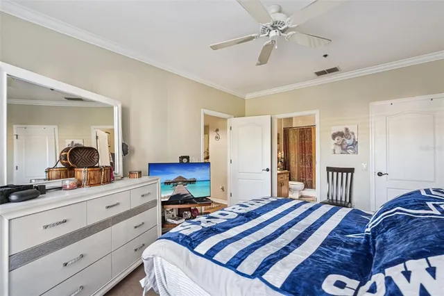 a bedroom with a bed dresser and a window