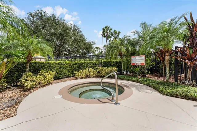 a view of a swimming pool with a yard
