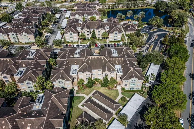 an aerial view of residential houses with outdoor space