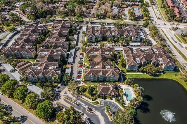 an aerial view of residential house with outdoor space and swimming pool