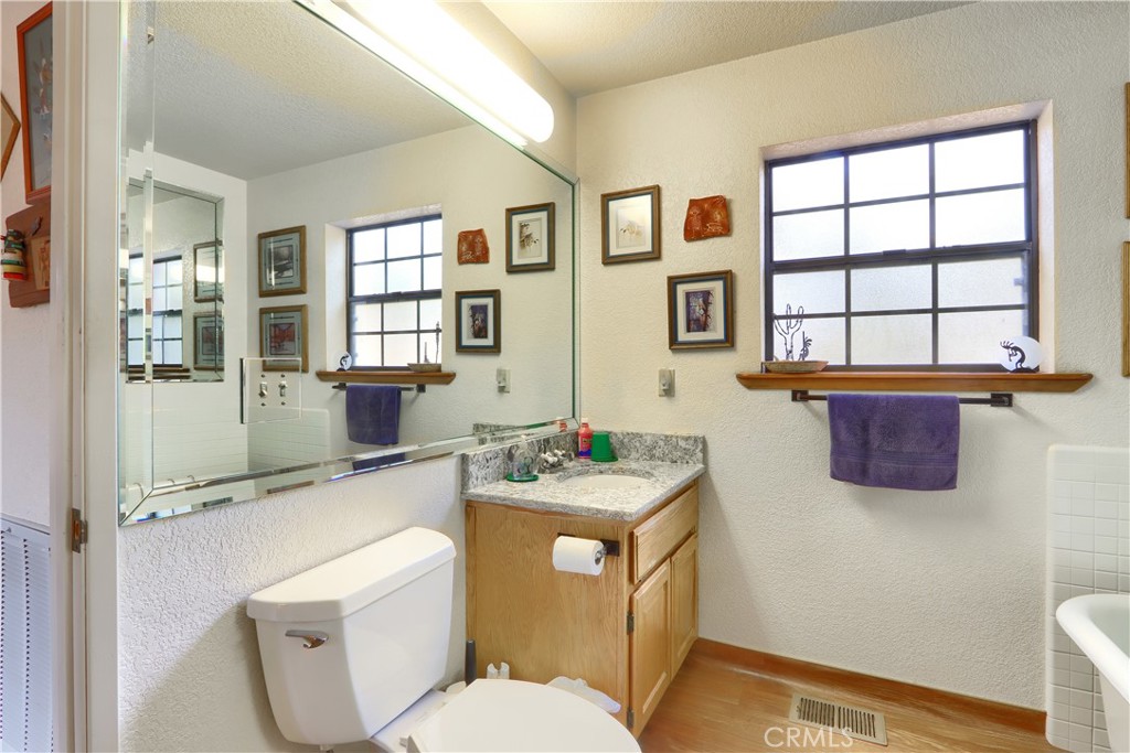 3692 Manzanita Road Mariposa, CA 95338 - Photo 20 of 71 a bathroom with a sink a toilet and shower curtain