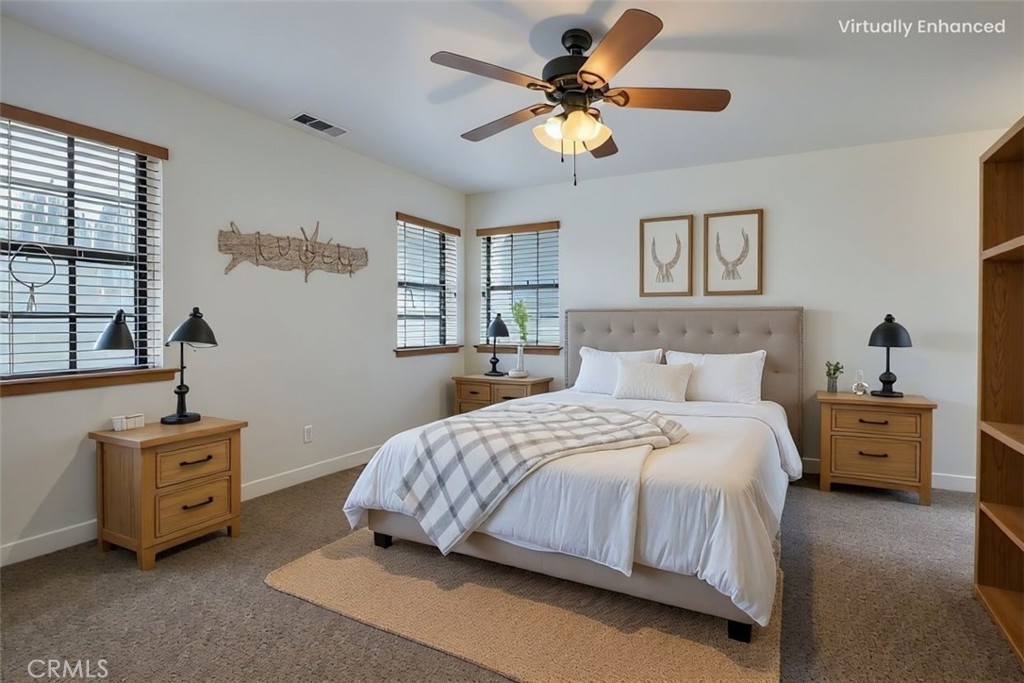3692 Manzanita Road Mariposa, CA 95338 - Photo 27 of 71 a bedroom with a bed and a chandelier