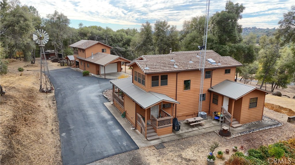 3692 Manzanita Road Mariposa, CA 95338 - Photo 38 of 71 a aerial view of a house with a yard table and chairs