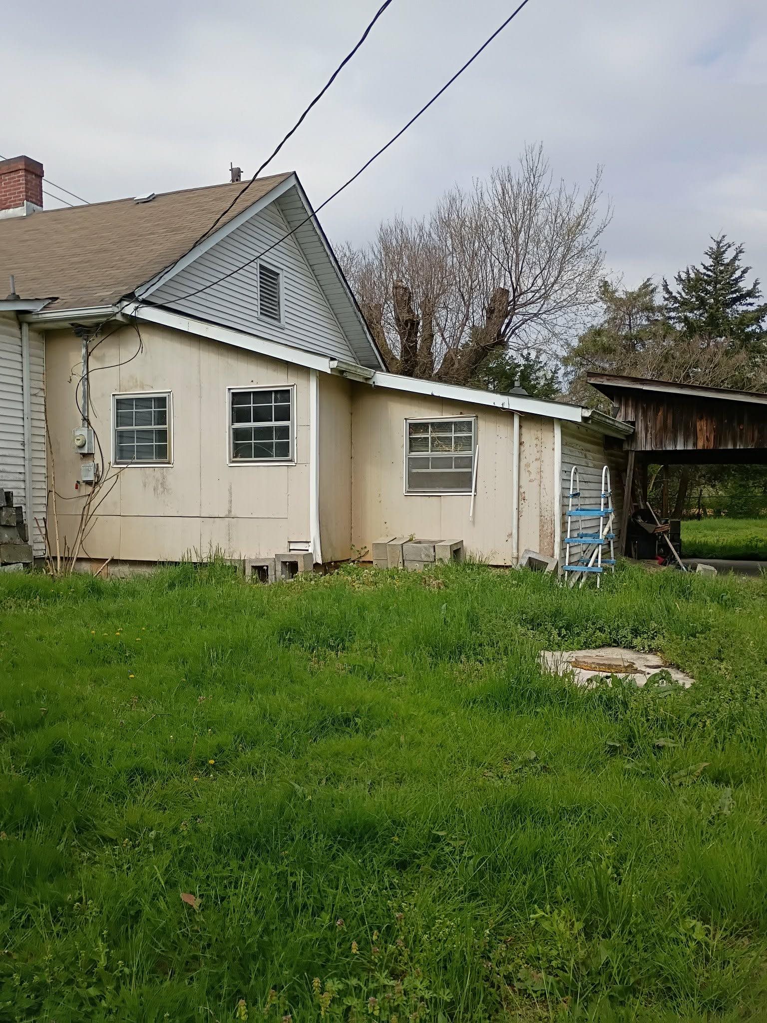 5255 Highway 30 Decatur, TN 37322 - Photo 12 of 36 Back of house with a chimney and a lawn