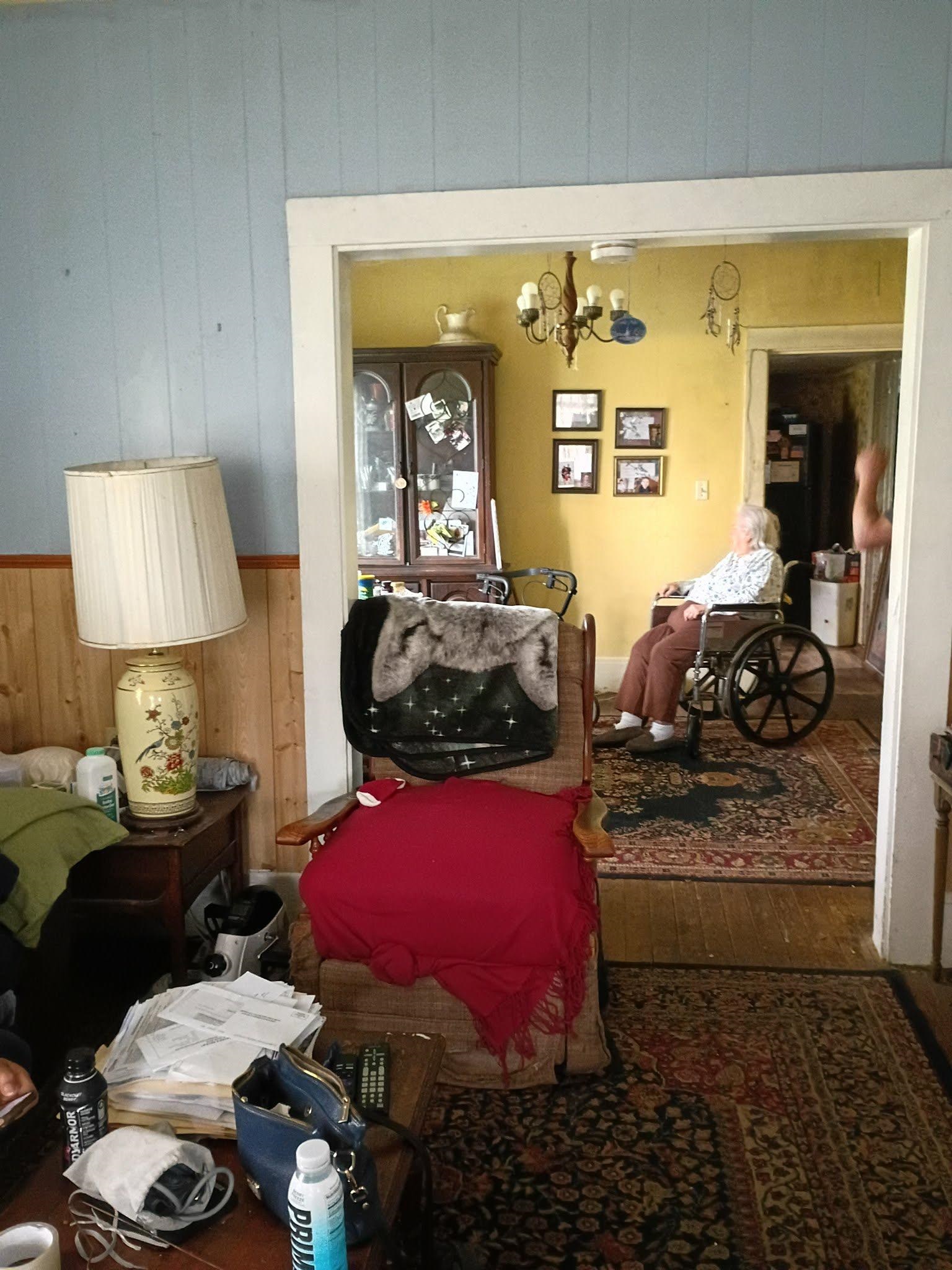 5255 Highway 30 Decatur, TN 37322 - Photo 13 of 36 Bedroom featuring wooden walls, suspended lighting, and hardwood / wood-style floors