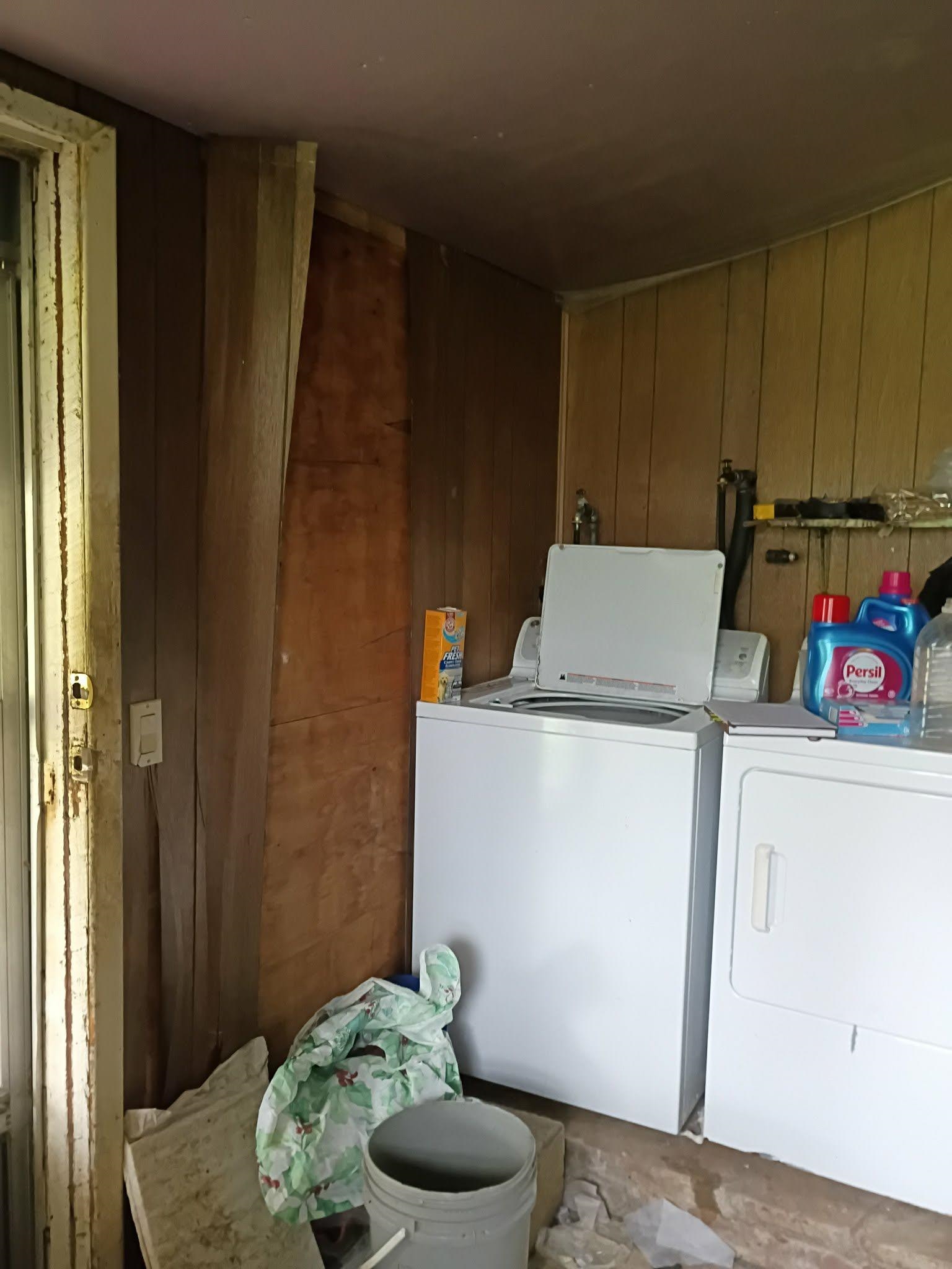 5255 Highway 30 Decatur, TN 37322 - Photo 22 of 36 Laundry area with wood walls and washing machine and clothes dryer