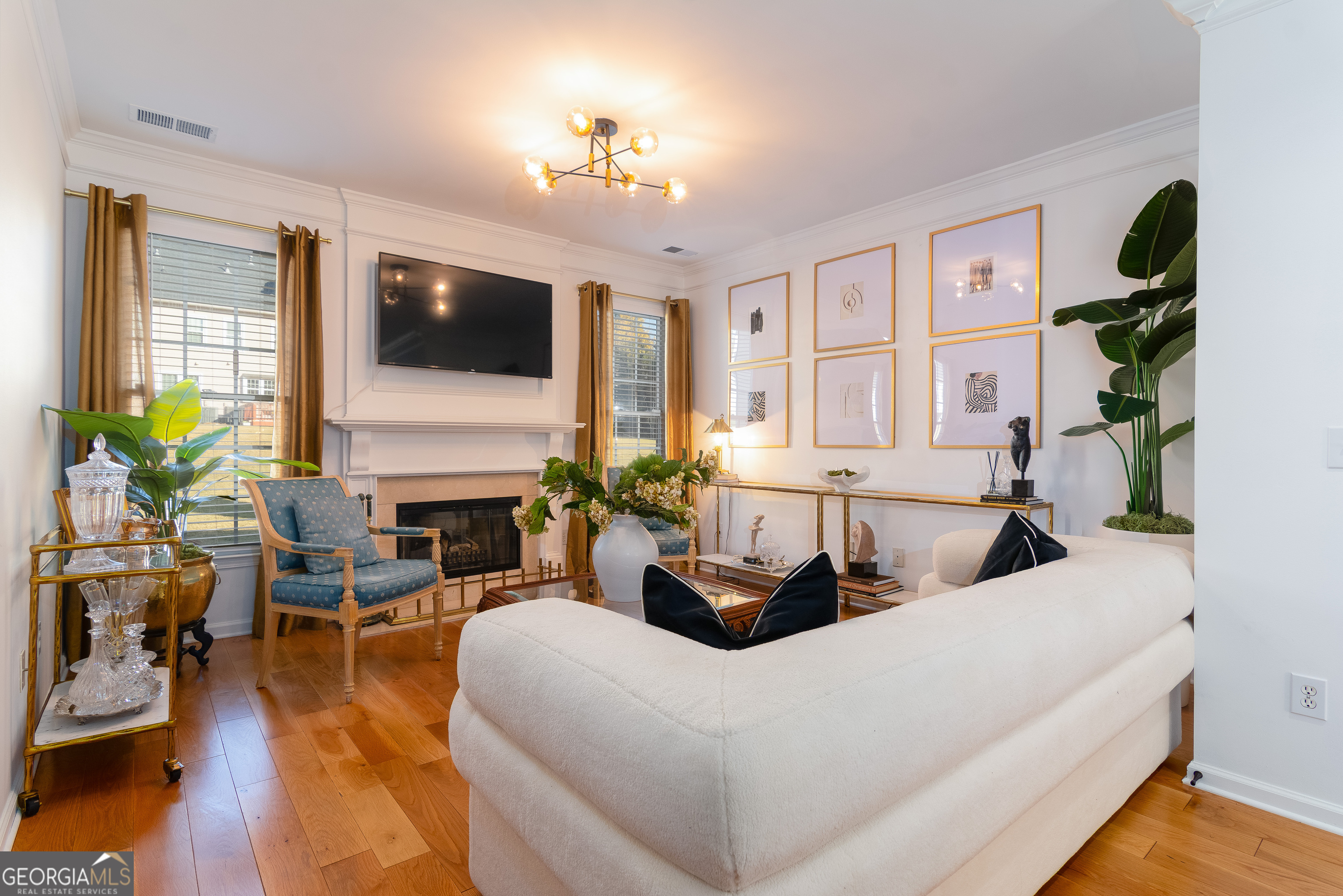 4957 Warmstone Way Southeast, Unit 15 Atlanta, GA 30339 - Photo 11 of 34 a living room with furniture and a flat screen tv