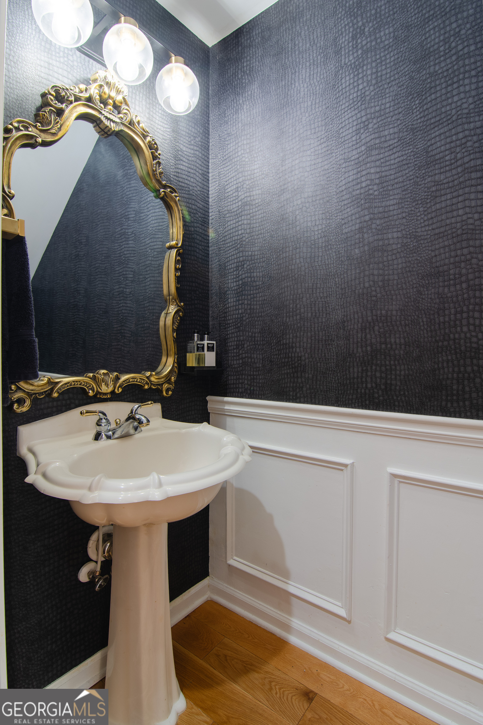 4957 Warmstone Way Southeast, Unit 15 Atlanta, GA 30339 - Photo 12 of 34 a bathroom with a sink and a mirror