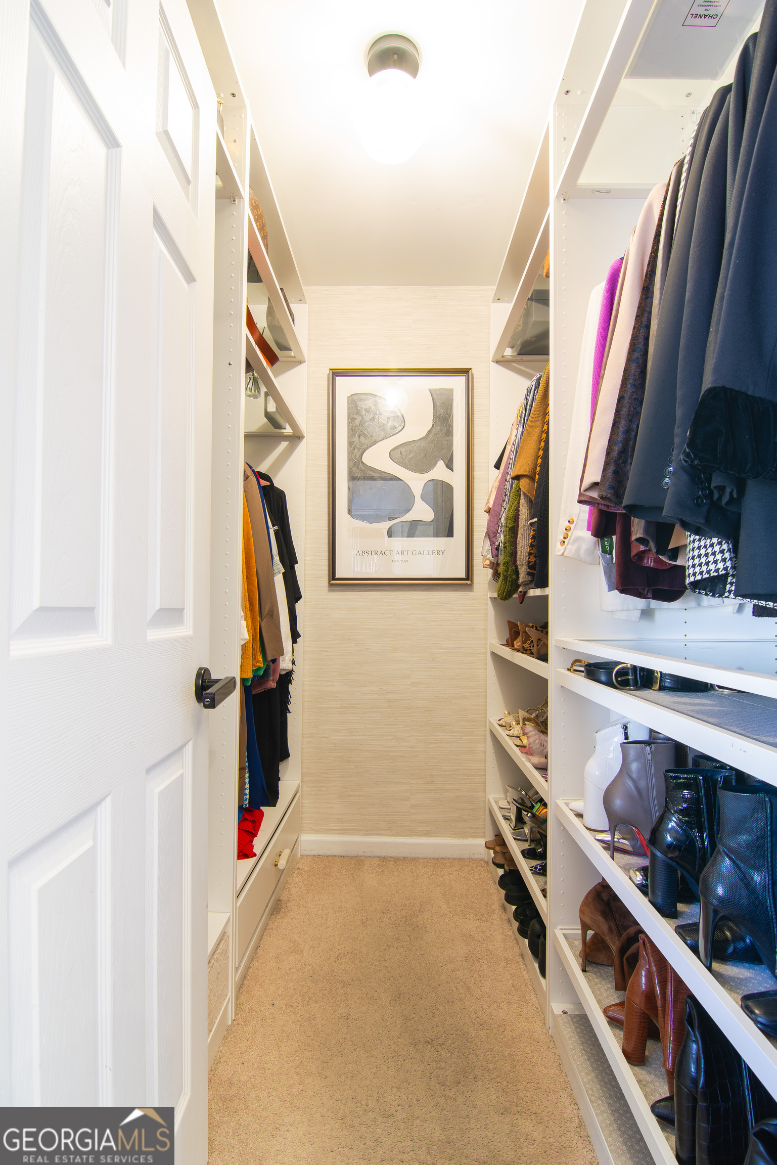 4957 Warmstone Way Southeast, Unit 15 Atlanta, GA 30339 - Photo 16 of 34 a view of closet with clothes and shoes