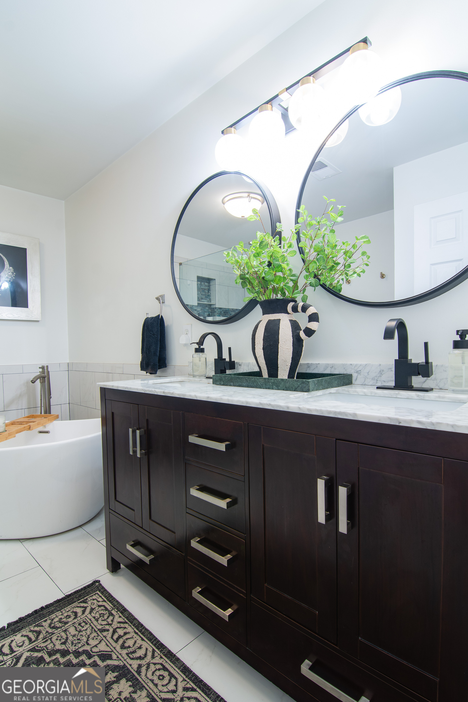 4957 Warmstone Way Southeast, Unit 15 Atlanta, GA 30339 - Photo 17 of 34 a bathroom with a double vanity sink and a mirror