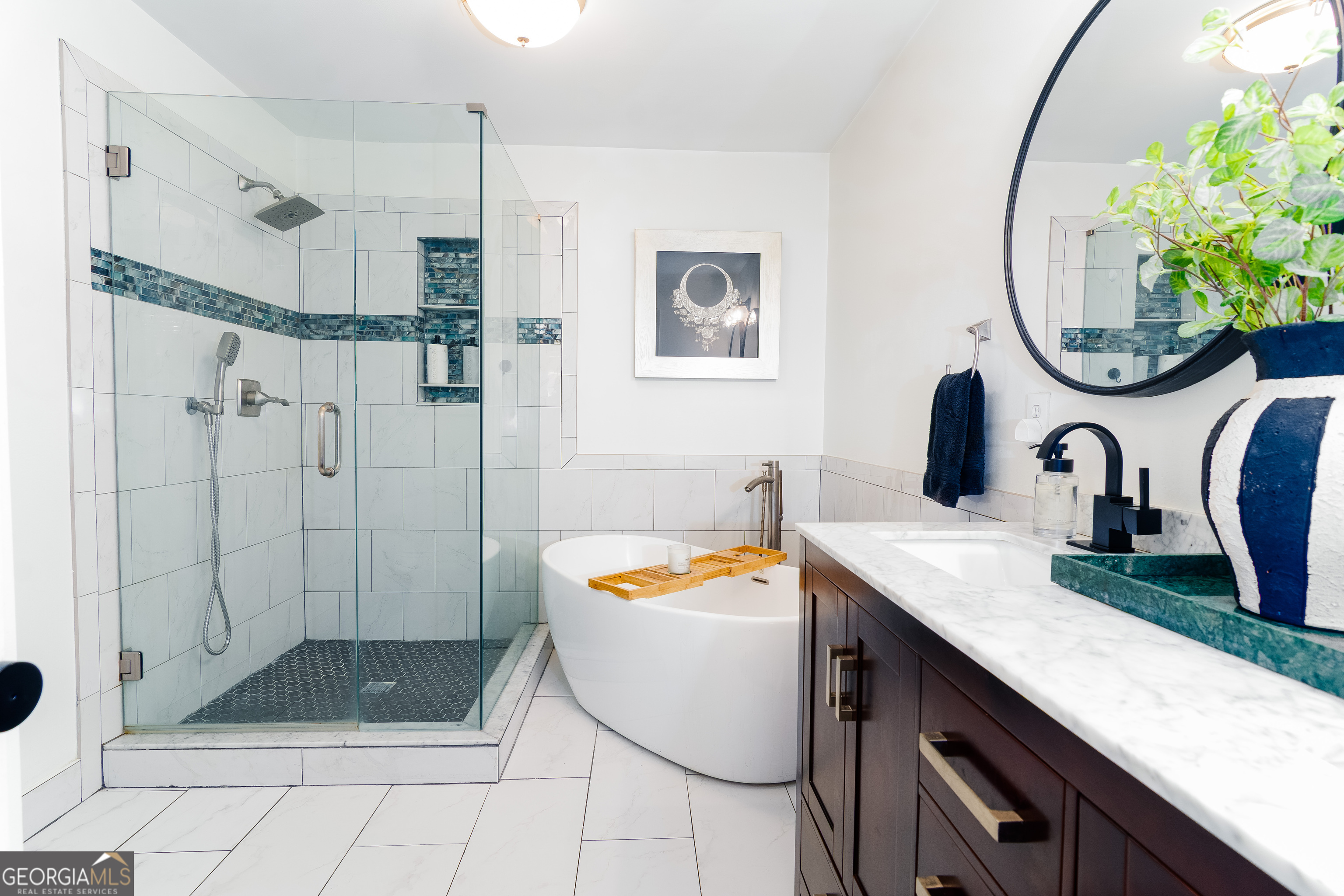 4957 Warmstone Way Southeast, Unit 15 Atlanta, GA 30339 - Photo 18 of 34 a bathroom with a sink a toilet and a shower
