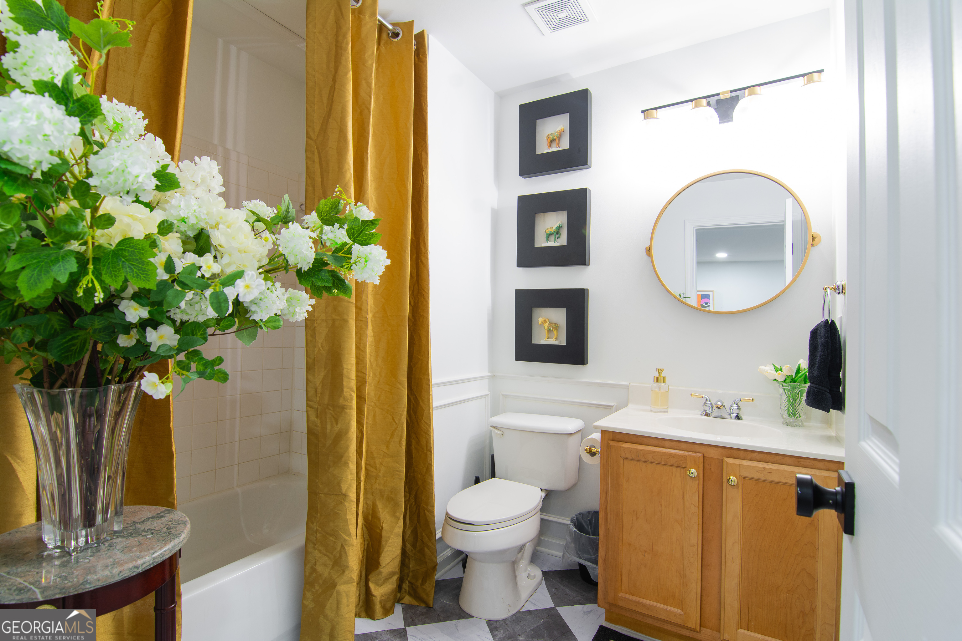 4957 Warmstone Way Southeast, Unit 15 Atlanta, GA 30339 - Photo 25 of 34 a bathroom with a toilet a sink and a mirror