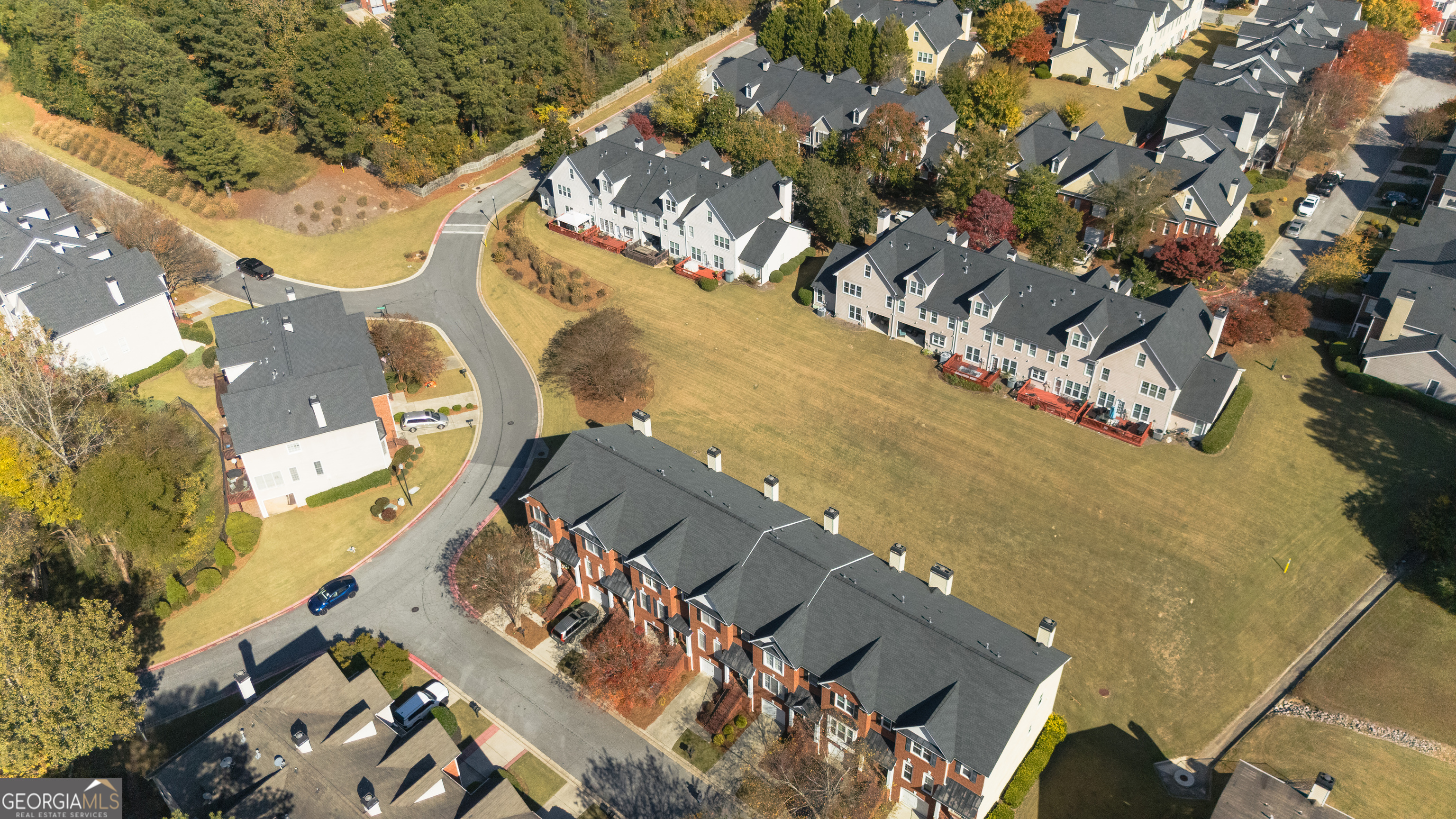4957 Warmstone Way Southeast, Unit 15 Atlanta, GA 30339 - Photo 28 of 34 an aerial view of a house with a yard