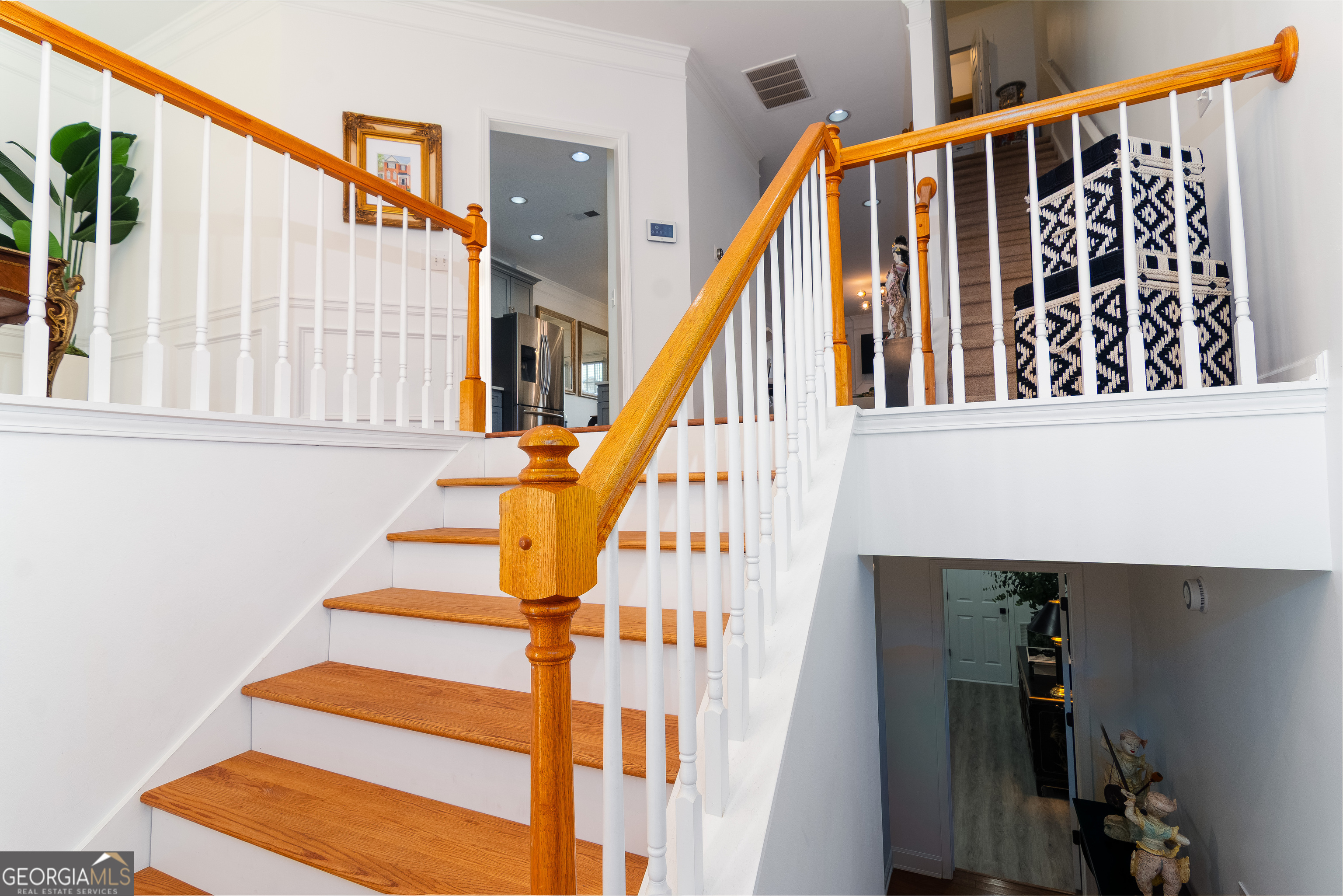 4957 Warmstone Way Southeast, Unit 15 Atlanta, GA 30339 - Photo 3 of 34 a view of entryway with wooden floor and stairs