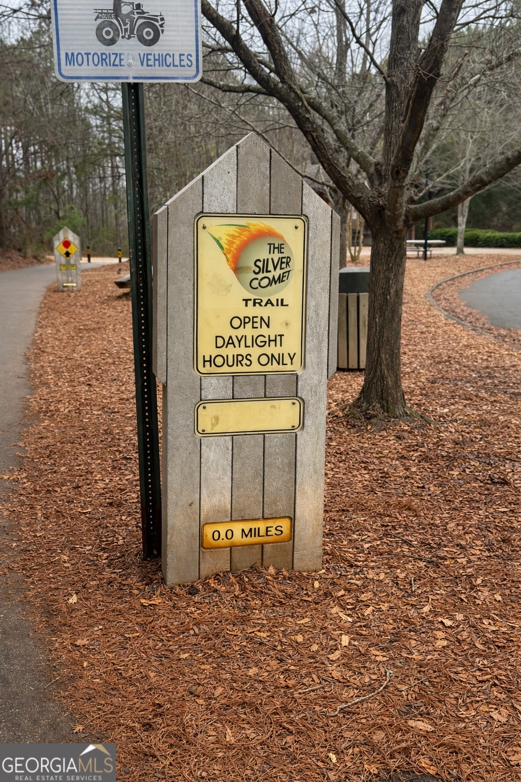 4957 Warmstone Way Southeast, Unit 15 Atlanta, GA 30339 - Photo 31 of 34 a sign that is on the side of the road