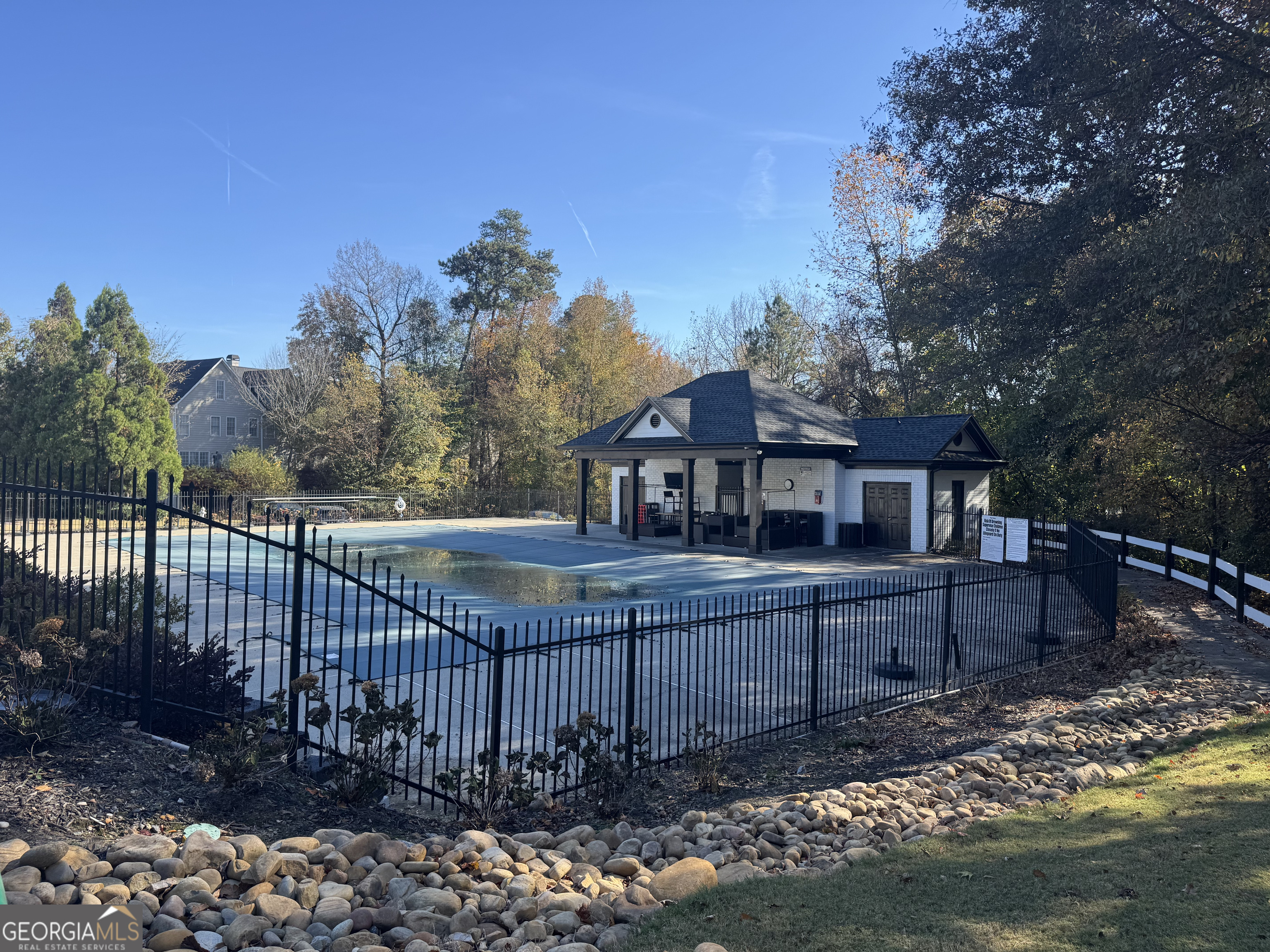 4957 Warmstone Way Southeast, Unit 15 Atlanta, GA 30339 - Photo 32 of 34 a front view of a house with a garden