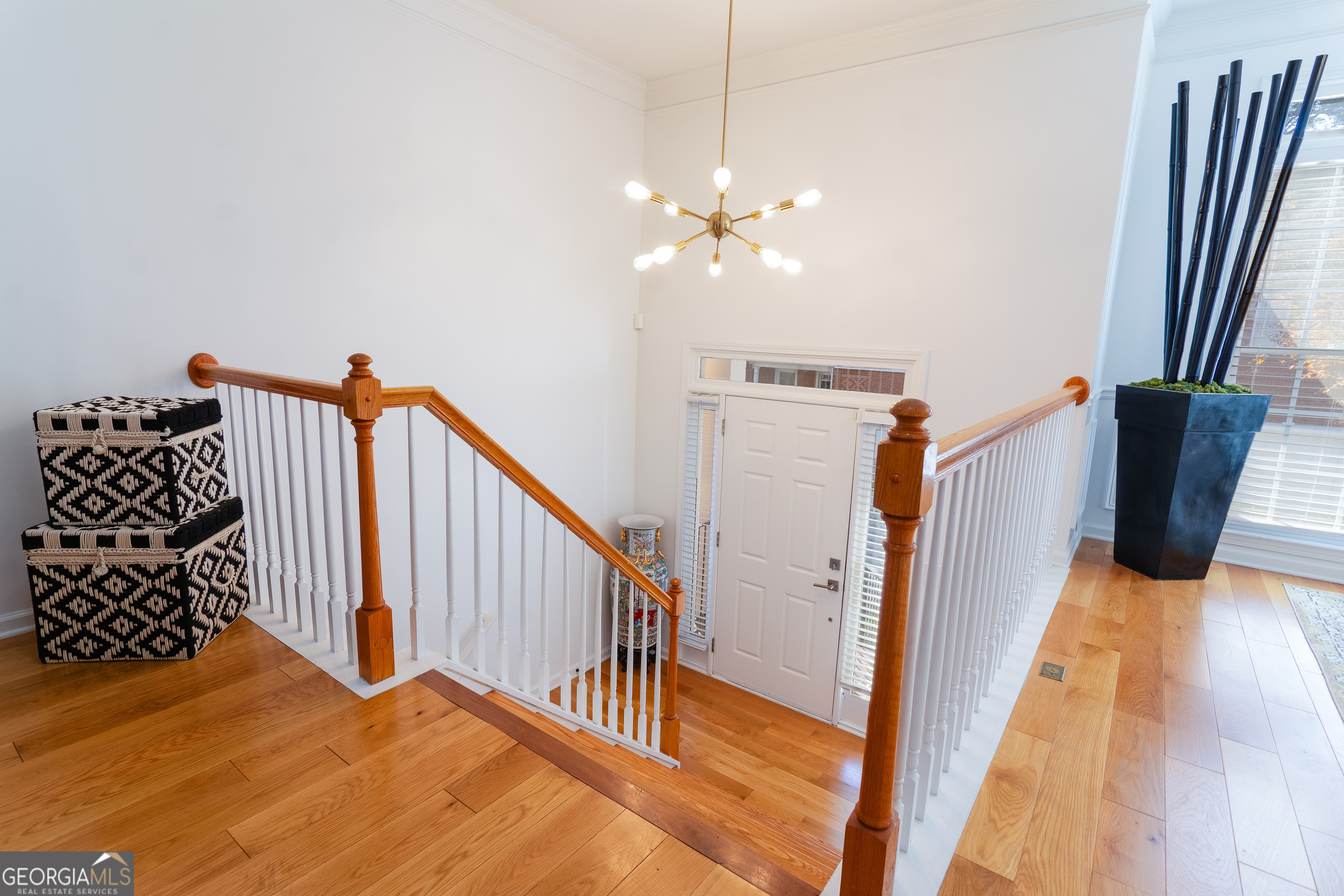 4957 Warmstone Way Southeast, Unit 15 Atlanta, GA 30339 - Photo 4 of 34 a view of a bedroom with wooden floor and stairs