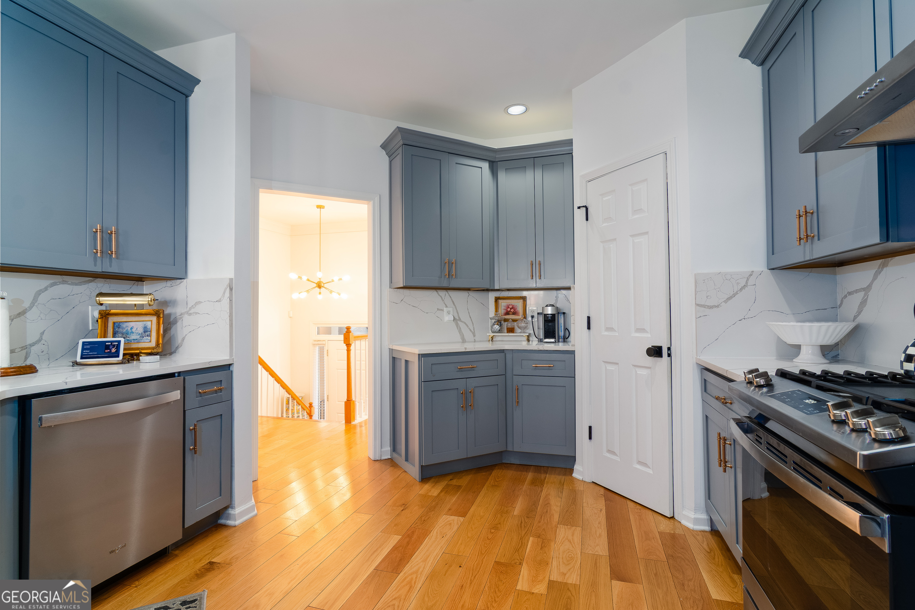 4957 Warmstone Way Southeast, Unit 15 Atlanta, GA 30339 - Photo 8 of 34 a kitchen with stainless steel appliances a stove a sink and a refrigerator