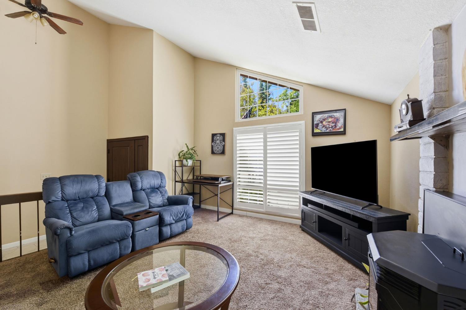 3283 Cambridge Road Cameron Park, CA 95682 - Photo 6 of 61 a living room with furniture and a flat screen tv