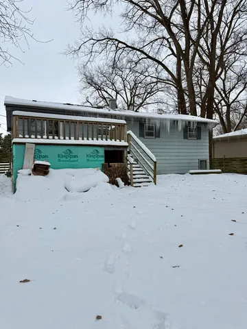 a view of snow covered with snow in front of yard