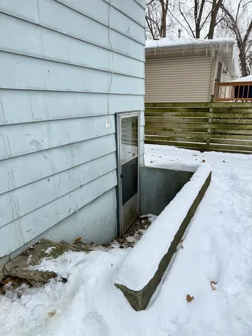 a view of wooden fence and trees