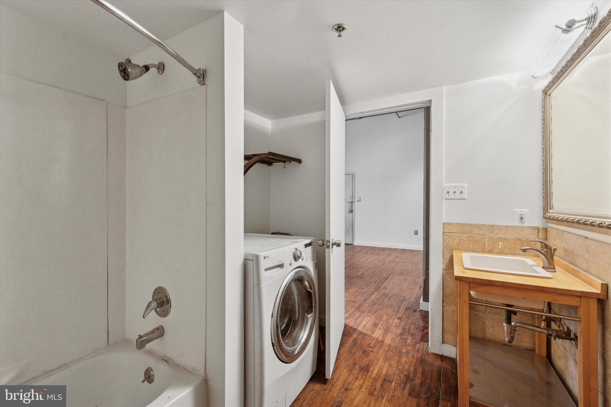 429 North 13th Street, Unit 3E Philadelphia, PA 19123 - Photo 10 of 11 a bathroom with a sink a toilet and shower
