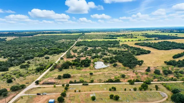 a view of a lake with a yard