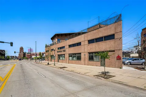 a front view of a building with street view