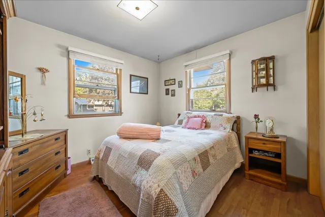 a bedroom with a bed and a desk