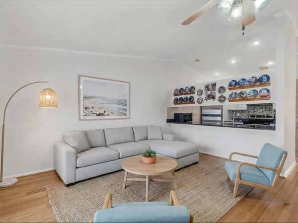 a living room with furniture and a painting