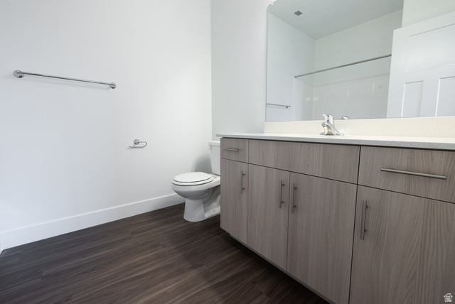 4653 South Alder Drive, Unit H302 Mapleton, UT 84664 - Photo 10 of 15 Bathroom featuring dark wood-style floors, vanity, and a shower