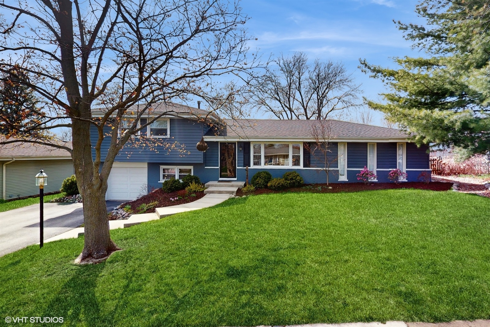 6040 Puffer Road Downers Grove, IL 60516 - Photo 1 of 29 a view of house with a big yard and large trees