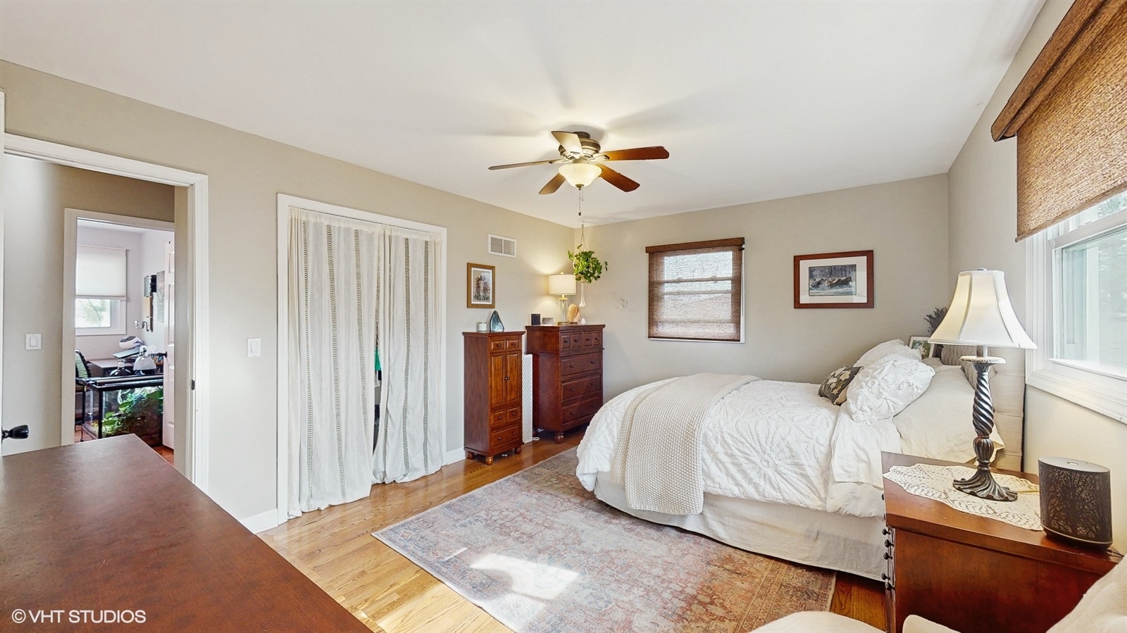 6040 Puffer Road Downers Grove, IL 60516 - Photo 16 of 29 a bedroom with a large bed and a chandelier