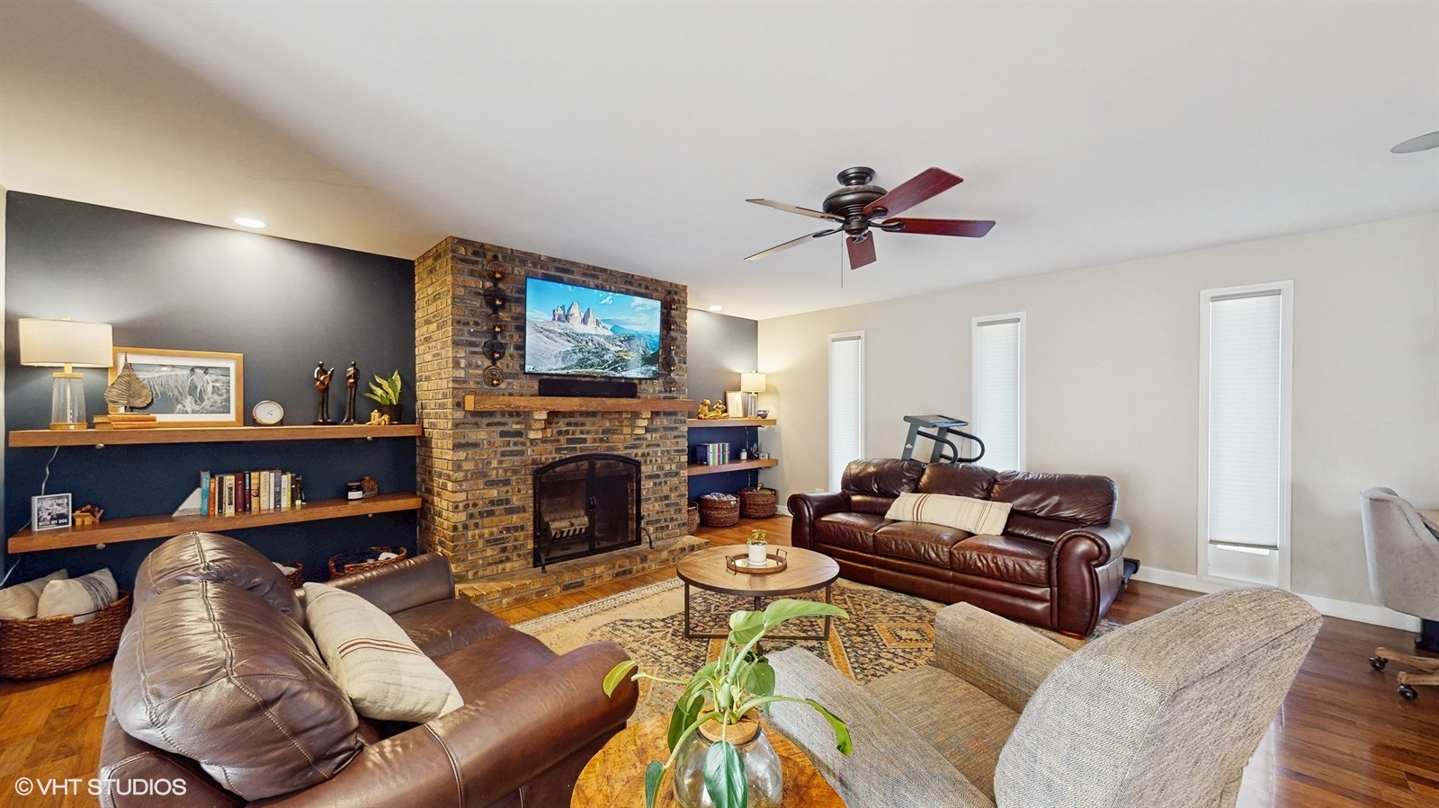 6040 Puffer Road Downers Grove, IL 60516 - Photo 5 of 29 a living room with furniture a fireplace and a flat screen tv