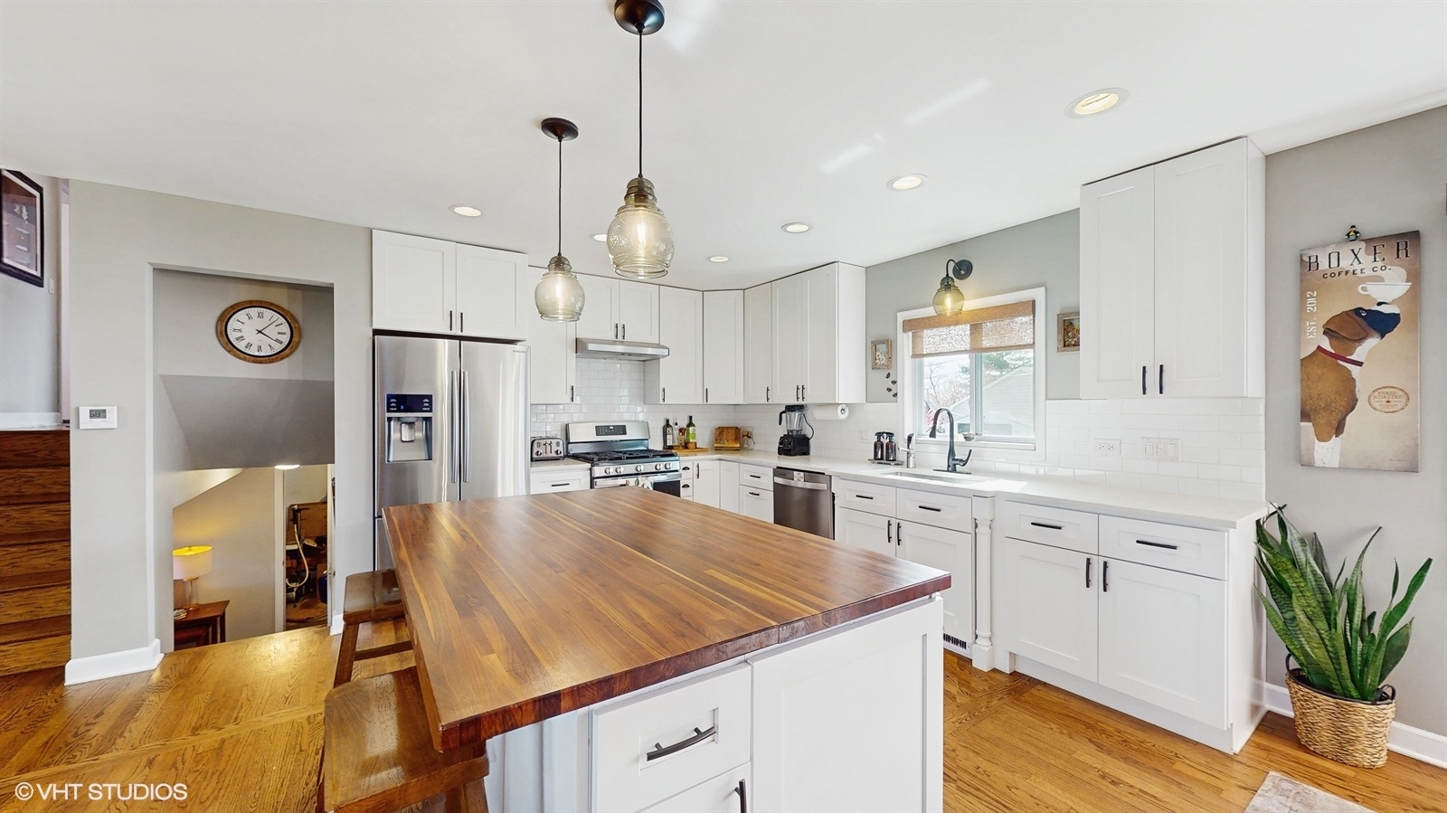 6040 Puffer Road Downers Grove, IL 60516 - Photo 10 of 29 a kitchen with stainless steel appliances kitchen island granite countertop a refrigerator a sink dishwasher a oven a dining table and chairs with wooden floor