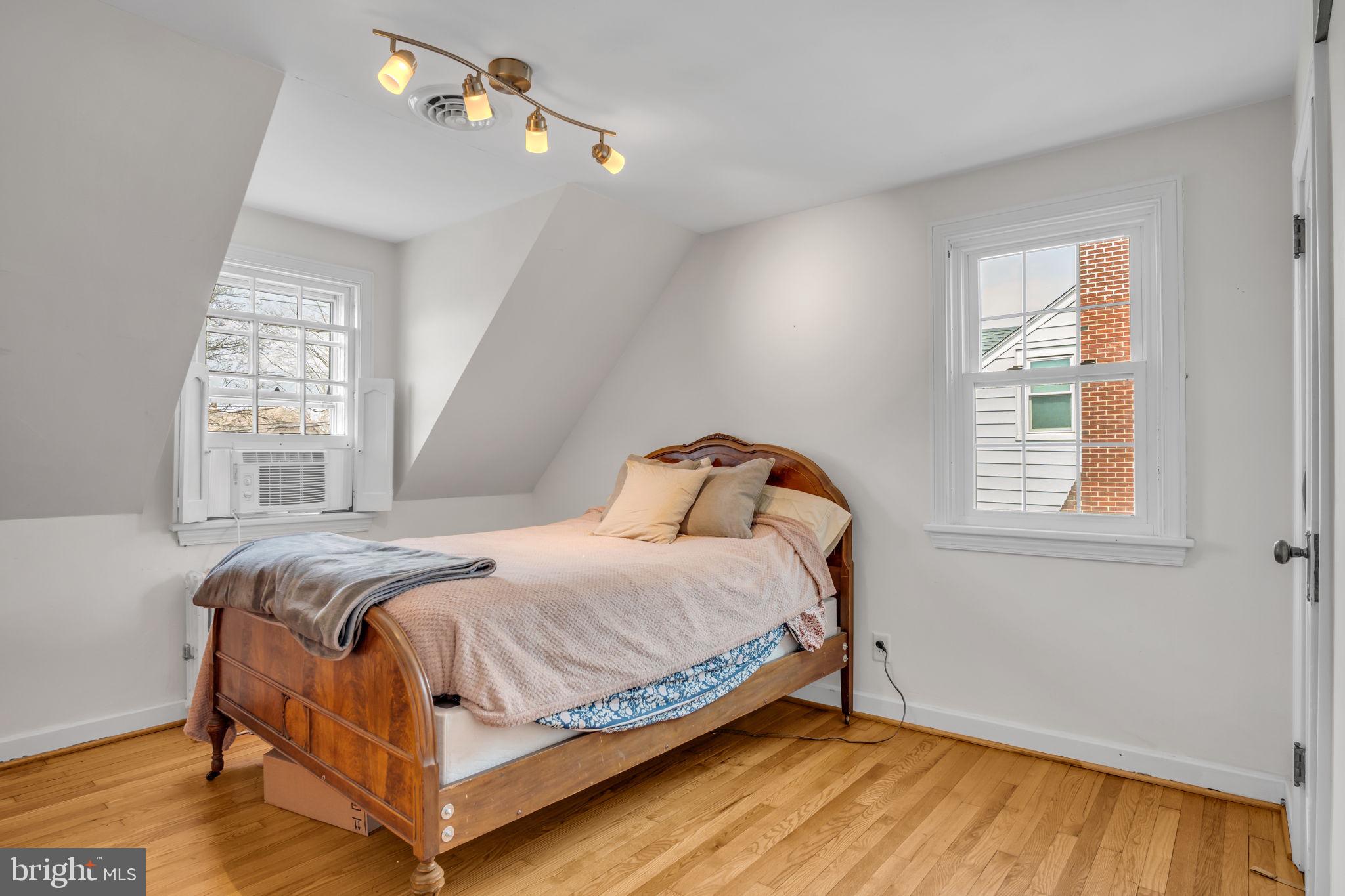 916 North Spring Street Middletown, PA 17057 - Photo 16 of 32 a bedroom with a bed and wooden floor