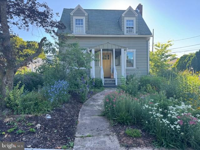 916 North Spring Street Middletown, PA 17057 - Photo 2 of 32 a view of a brick house with lots of flower plants