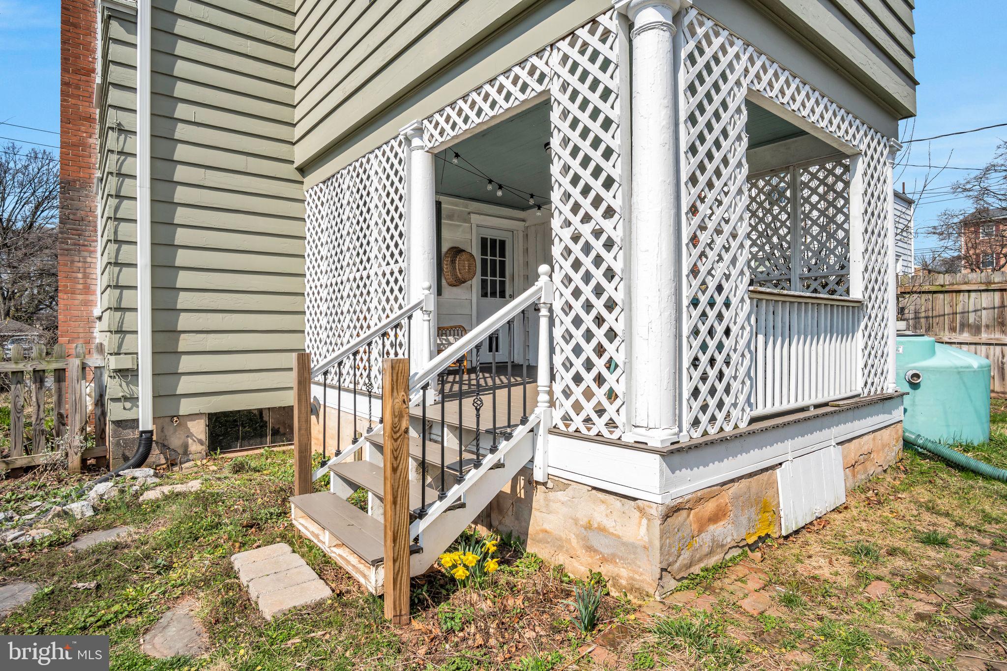916 North Spring Street Middletown, PA 17057 - Photo 23 of 32 a view of wooden house with a small yard and potted plants