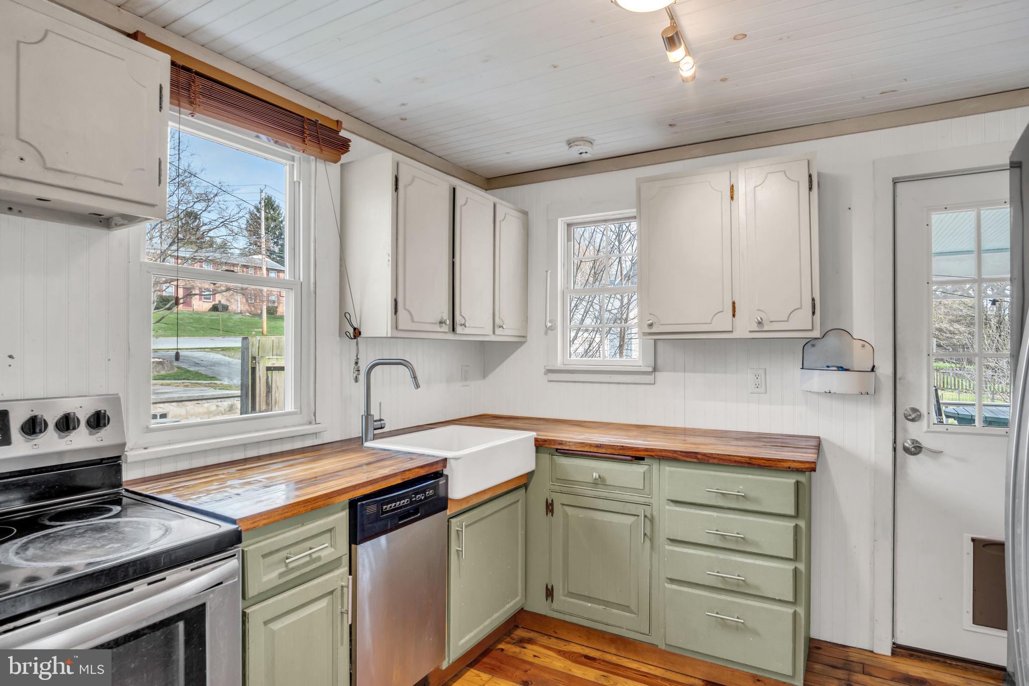916 North Spring Street Middletown, PA 17057 - Photo 10 of 32 a kitchen with white cabinets and appliances