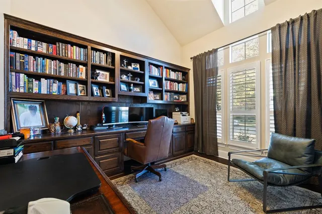 a work room with furniture and a bookshelf