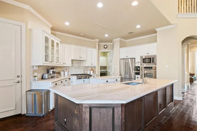 a kitchen with counter top space cabinets and stainless steel appliances