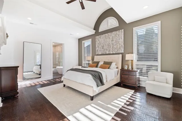 a bedroom with a large bed and a couch