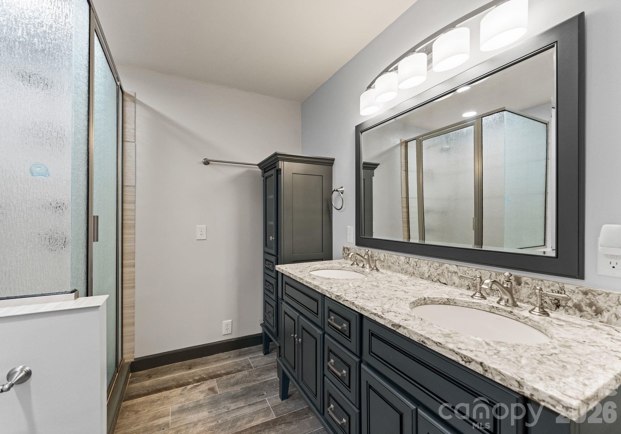 150 Barber Lyerly Road Salisbury, NC 28147 - Photo 19 of 43 a bathroom with a granite countertop double vanity sink and a mirror