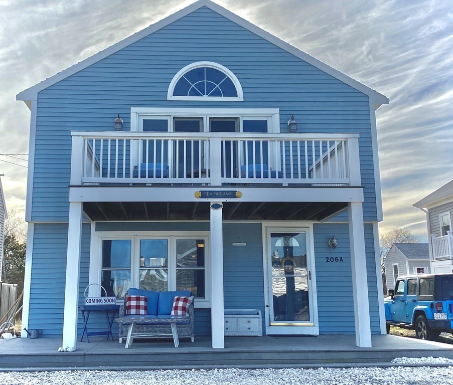 206 A Phillips Road Sandwich, MA 02563 - Photo 1 of 25 a view of a house with a balcony