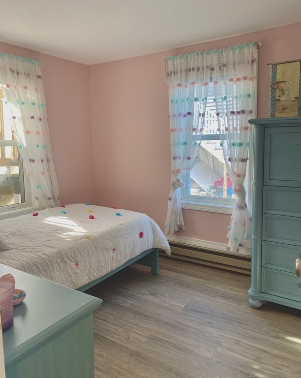 206 A Phillips Road Sandwich, MA 02563 - Photo 8 of 25 a bedroom with a bed and a window